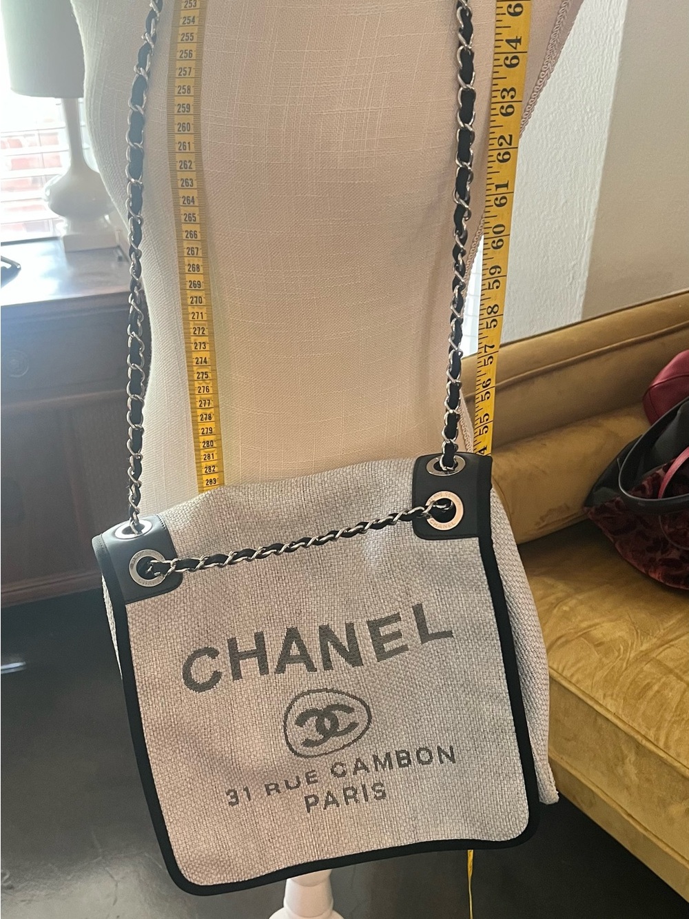 CHANEL Beige Canvas Shoulder Bag with Black Trim and Chain Strap